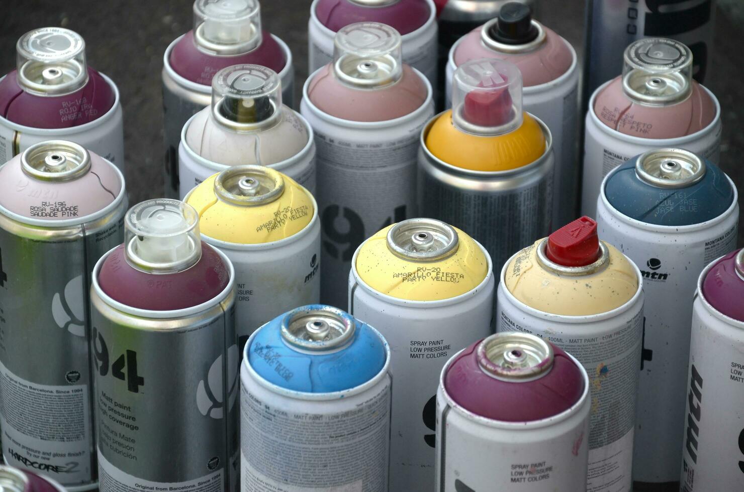 Montana mtn 94 and Kobra used spray cans for graffiti painting outdoors photo