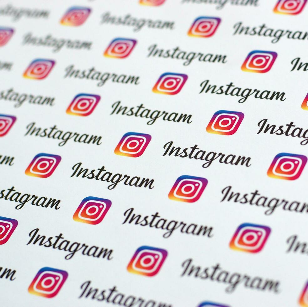 Instagram pattern printed on paper with small instagram logos and inscriptions. Instagram is American photo and video-sharing social networking service owned by Facebook