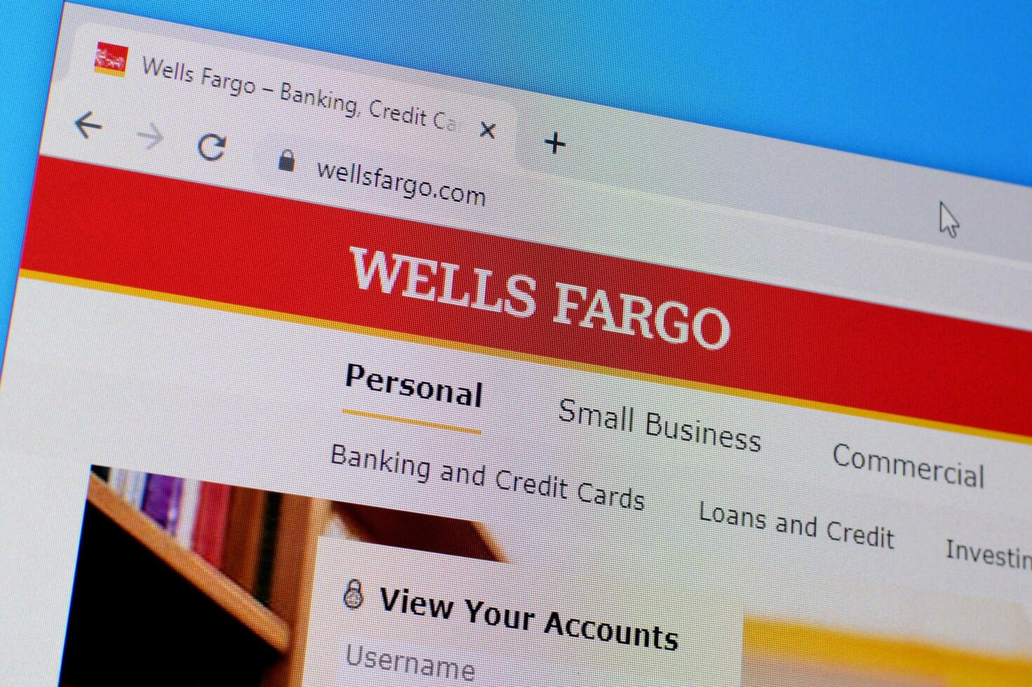 Homepage of wells fargo website on the display of PC, url - wellsfargo.com. photo