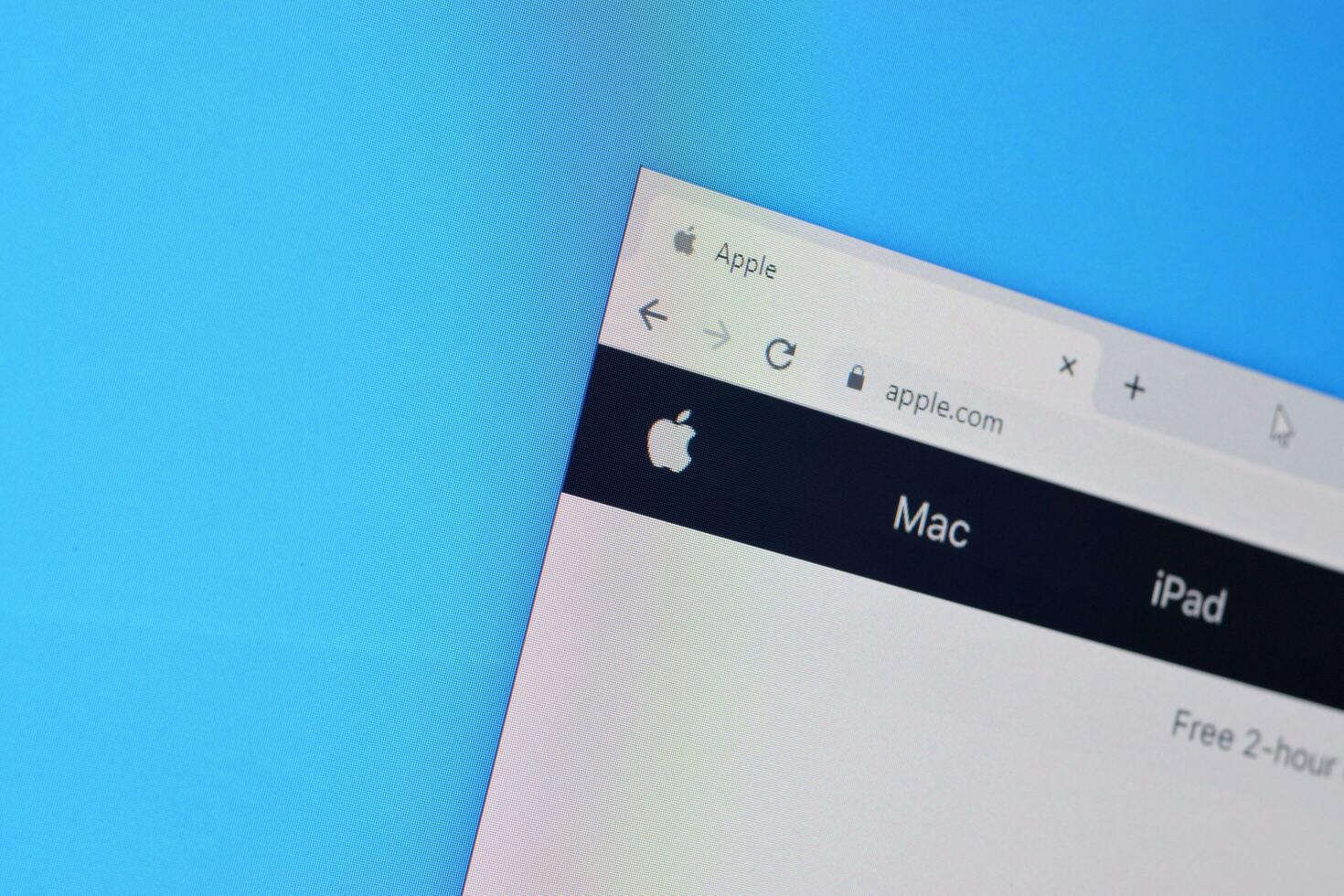 Homepage of apple website on the display of PC, url - apple.com. photo