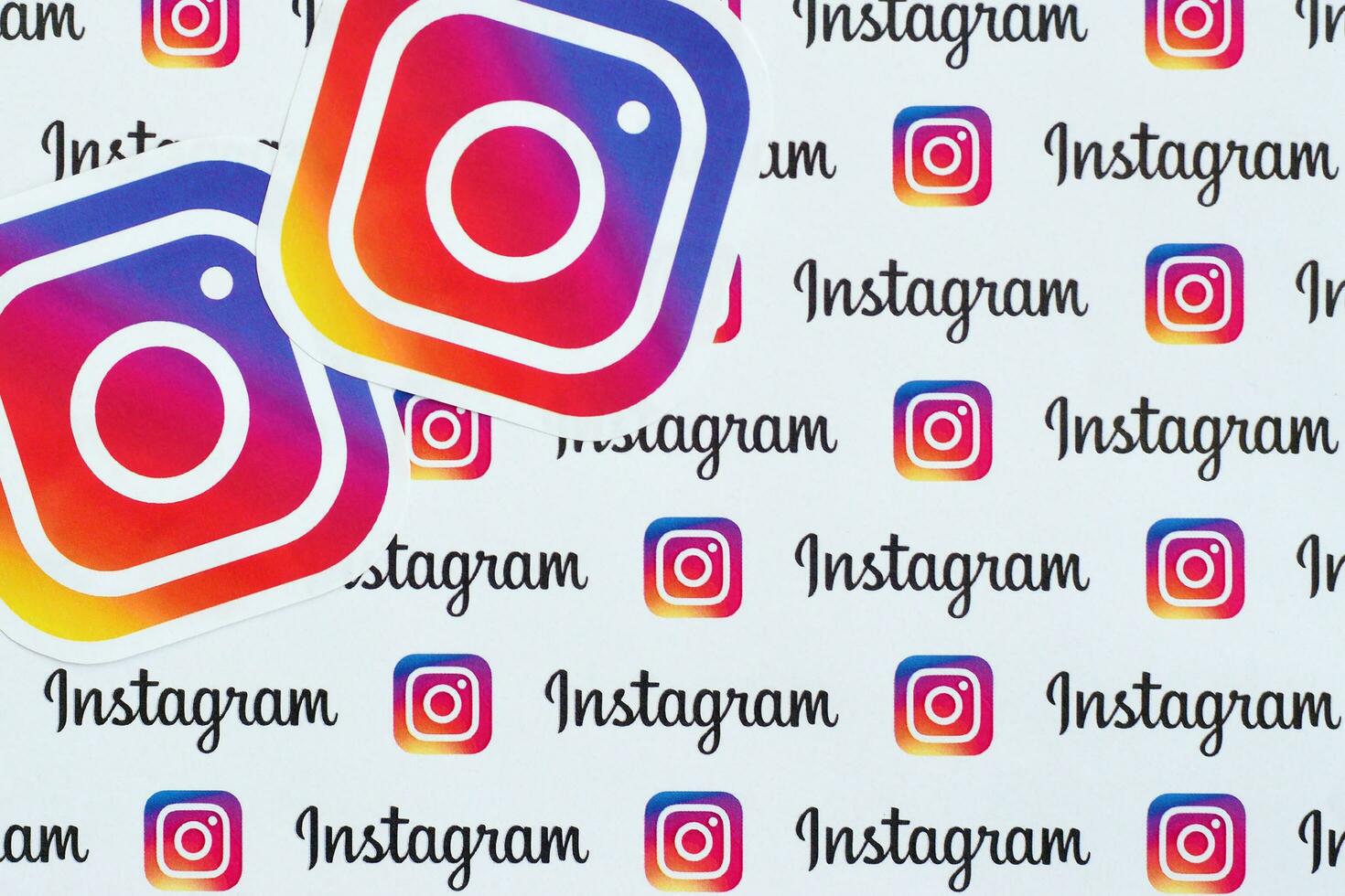 Instagram pattern printed on paper with small instagram logos and inscriptions. Instagram is American photo and video-sharing social networking service owned by Facebook