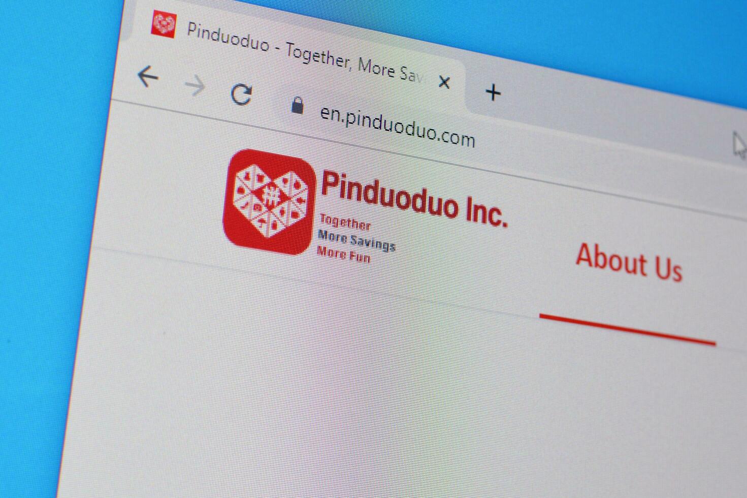 Homepage of pinduoduo website on the display of PC, url - pinduoduo.com. photo
