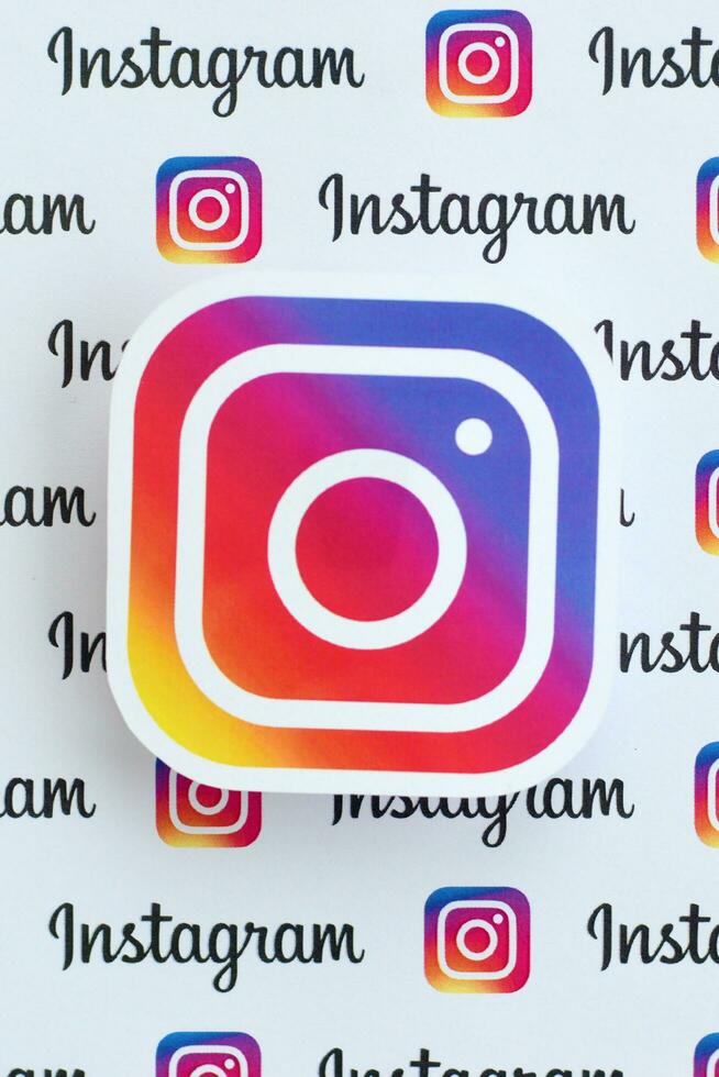 Instagram pattern printed on paper with small instagram logos and inscriptions. Instagram is American photo and video-sharing social networking service owned by Facebook