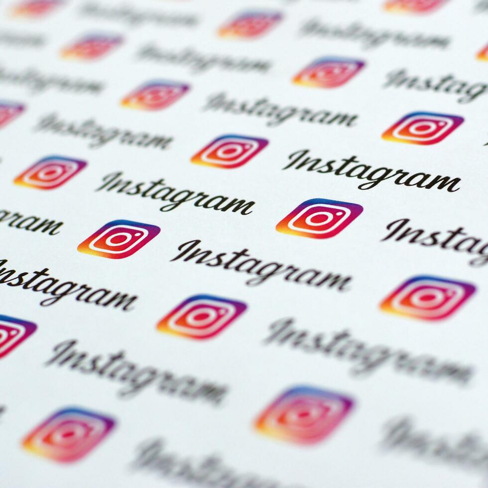 Instagram pattern printed on paper with small instagram logos and inscriptions. Instagram is American photo and video-sharing social networking service owned by Facebook