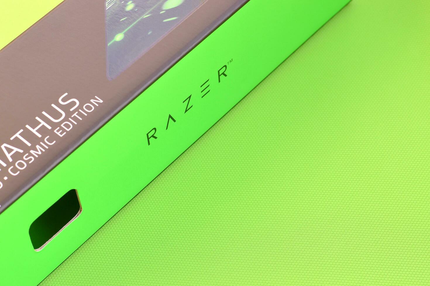 Razer Goliathus Speed Gaming green mouse pad and box with logo. Razer global gaming hardware manufacturing company, as well as an esports and financial services photo