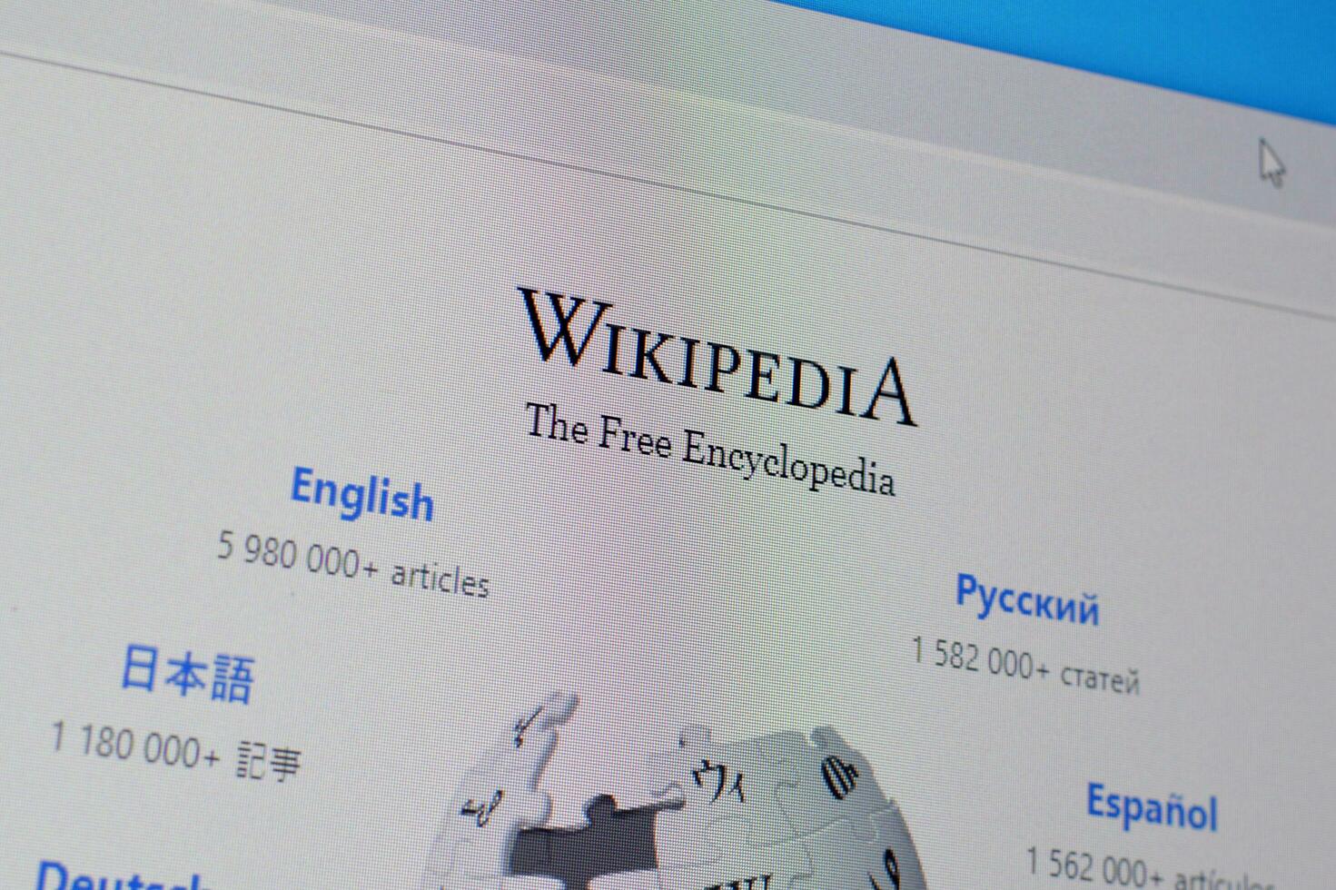 Homepage of wikipedia website on the display of PC, url - wikipedia.org. photo