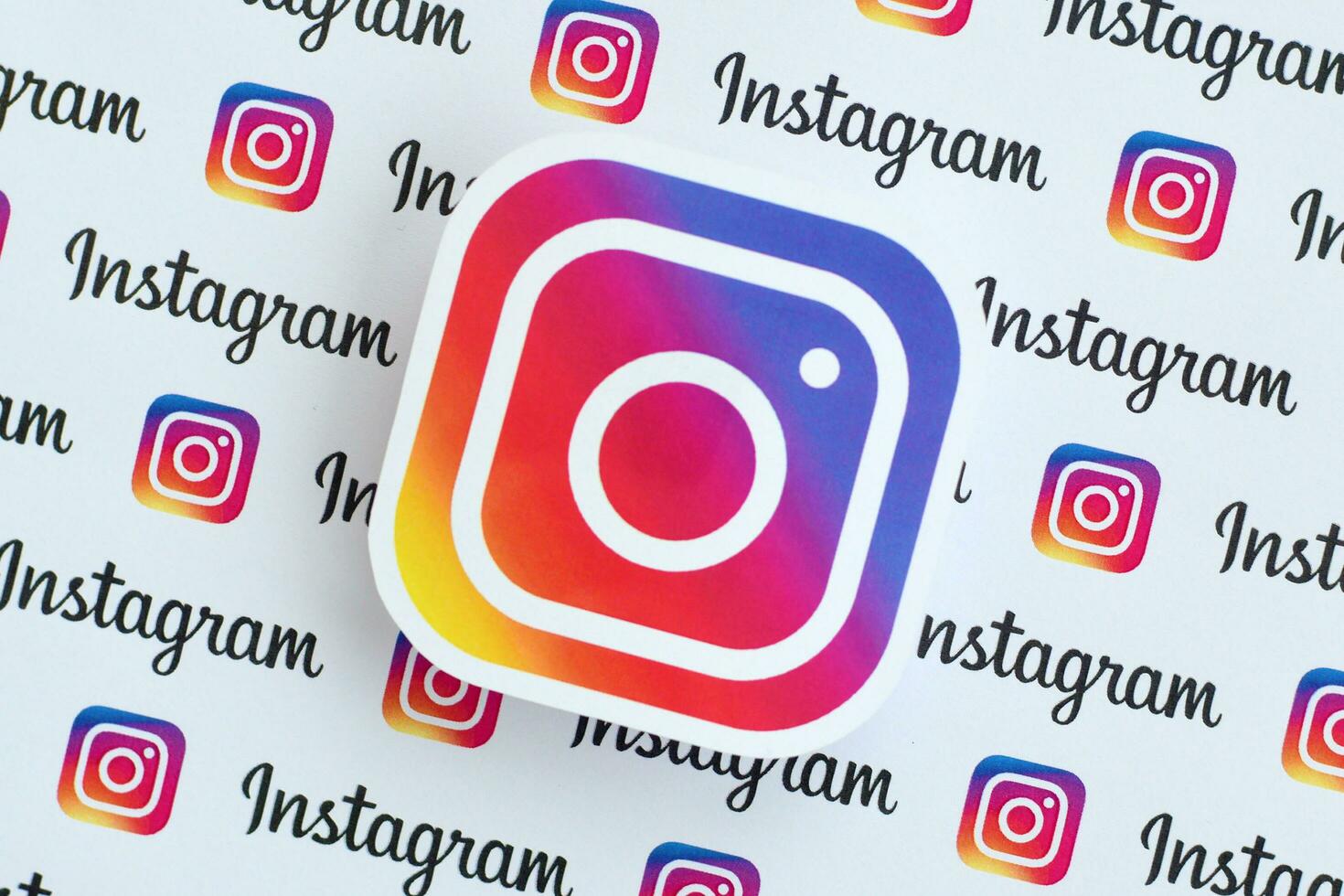 Instagram pattern printed on paper with small instagram logos and inscriptions. Instagram is American photo and video-sharing social networking service owned by Facebook