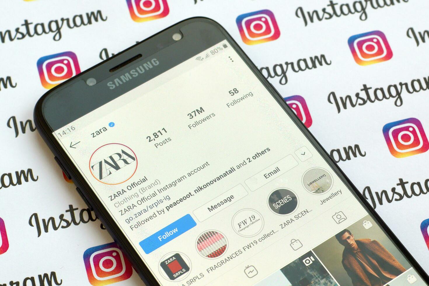 Zara official instagram account on smartphone screen on paper instagram banner. photo