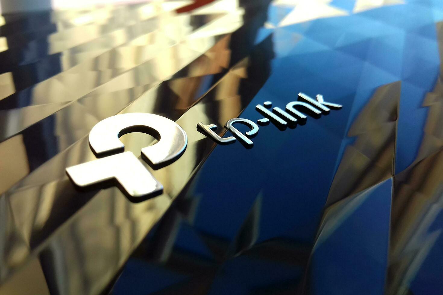 New tp-link logo on wireless router modem tp link Archer C20 AC750 reflective surface photo