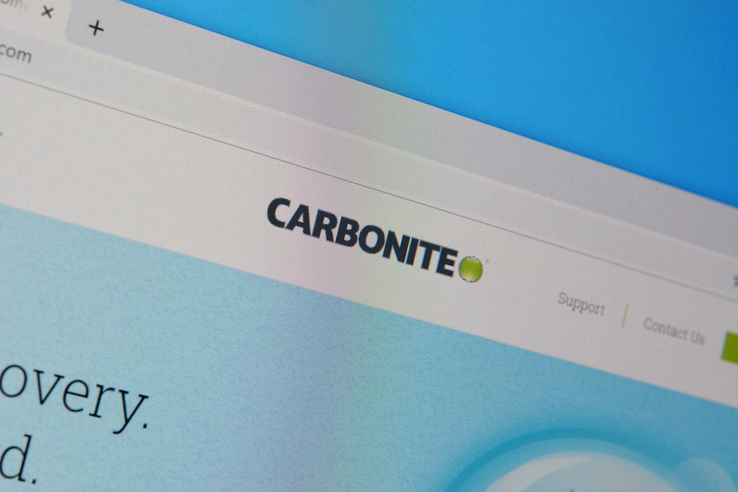 Homepage of carbonite website on the display of PC, url - carbonite.com. photo