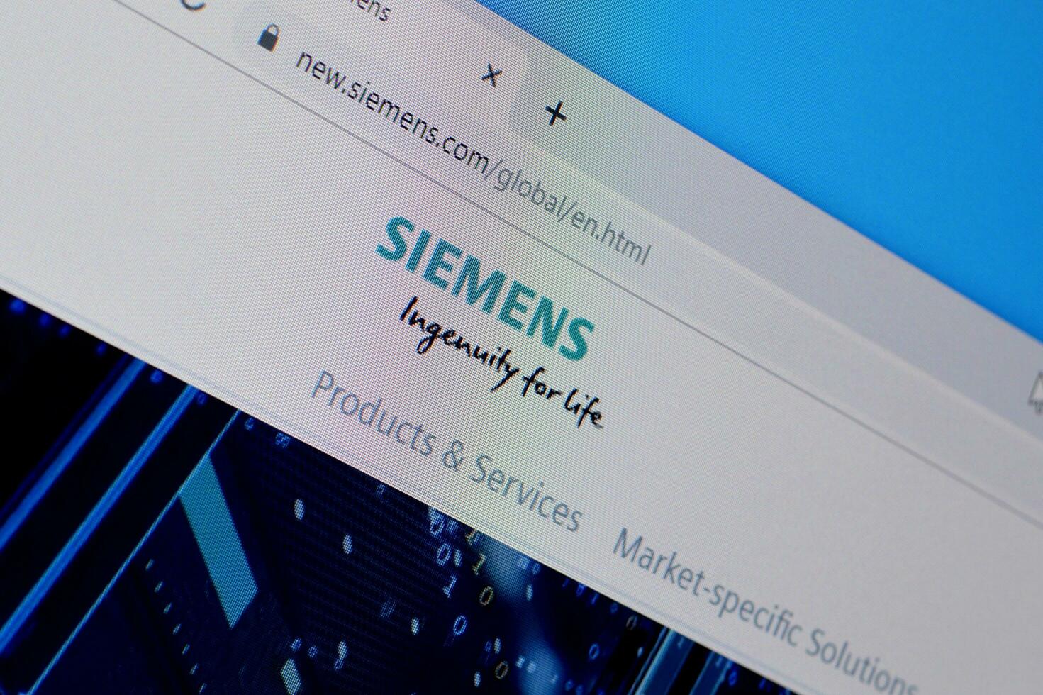 Homepage of siemens website on the display of PC, url - siemens.com. photo
