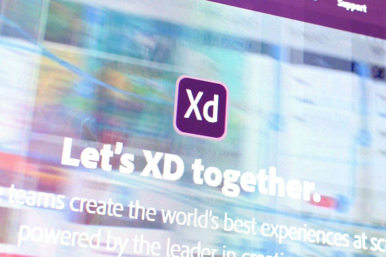 Web page of adobe xd product on official website on the display of PC photo