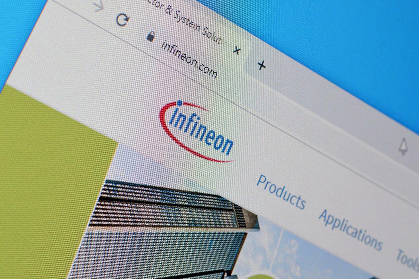 Homepage of infineon website on the display of PC, url - infineon.com. photo