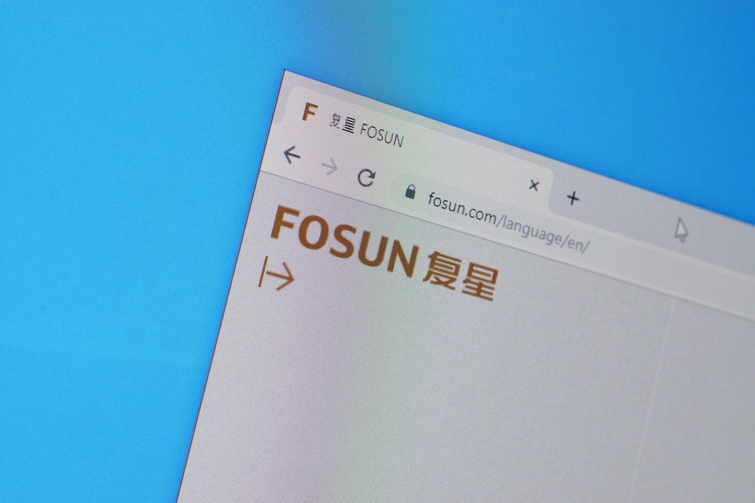 Homepage of fosun website on the display of PC, url - fosun.com. photo