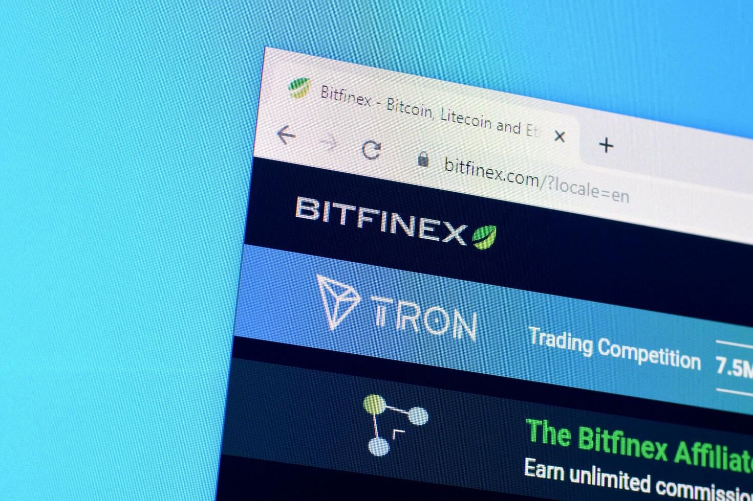 Homepage of bitfinex website on the display of PC, url - bitfinex.com. photo