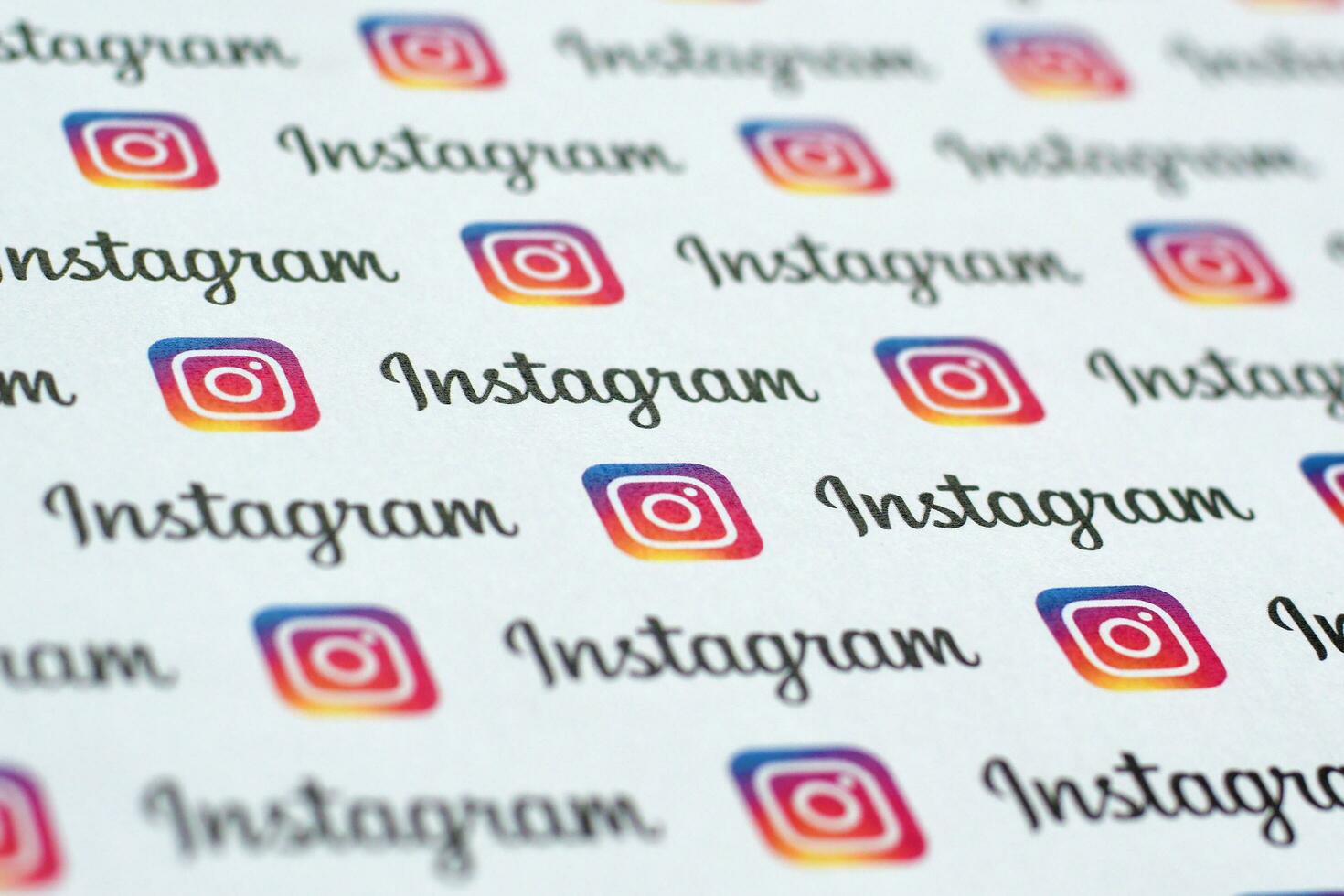 Instagram pattern printed on paper with small instagram logos and inscriptions. Instagram is American photo and video-sharing social networking service owned by Facebook