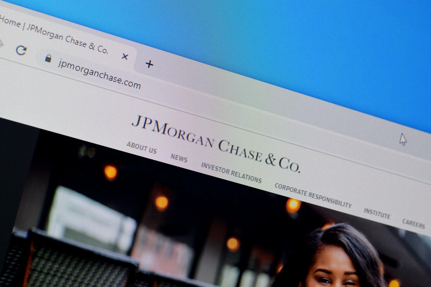 Homepage of jp morgan chase website on the display of PC, url - jpmorganchase.com. photo