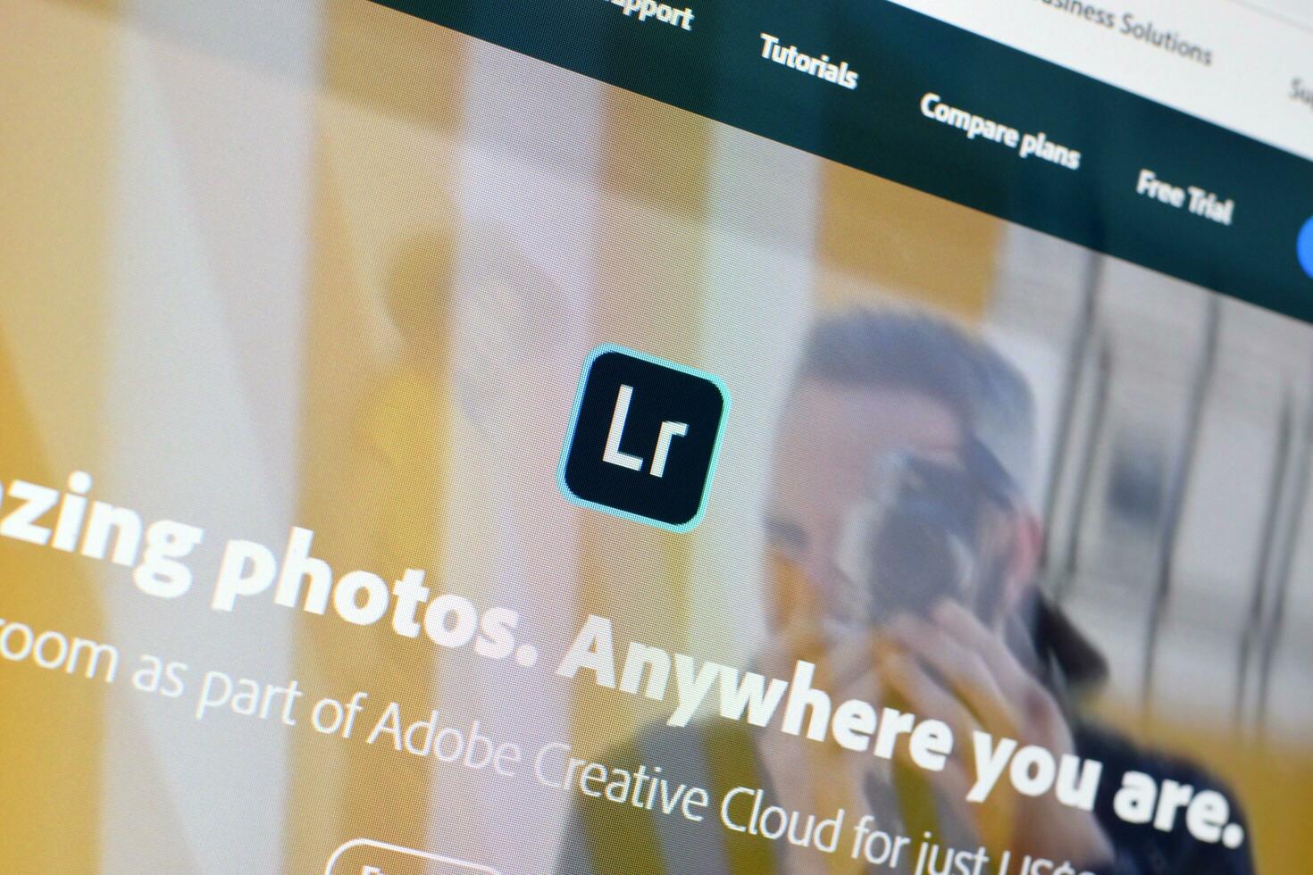 Web page of adobe lightroom product on official website on the display of PC photo