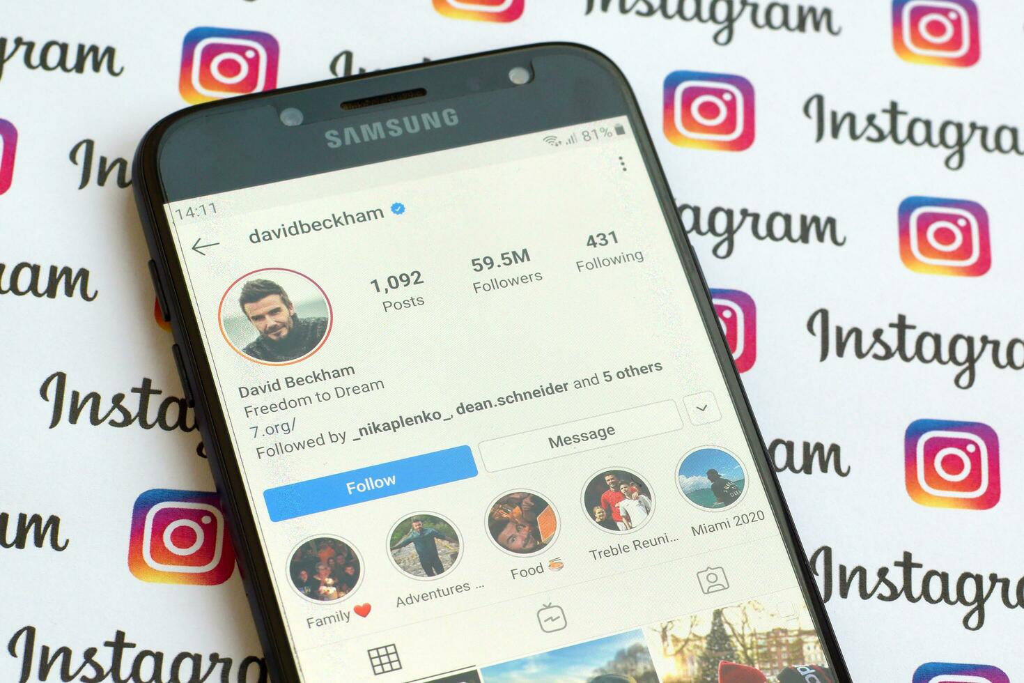 David Beckham official instagram account on smartphone screen on paper instagram banner. photo