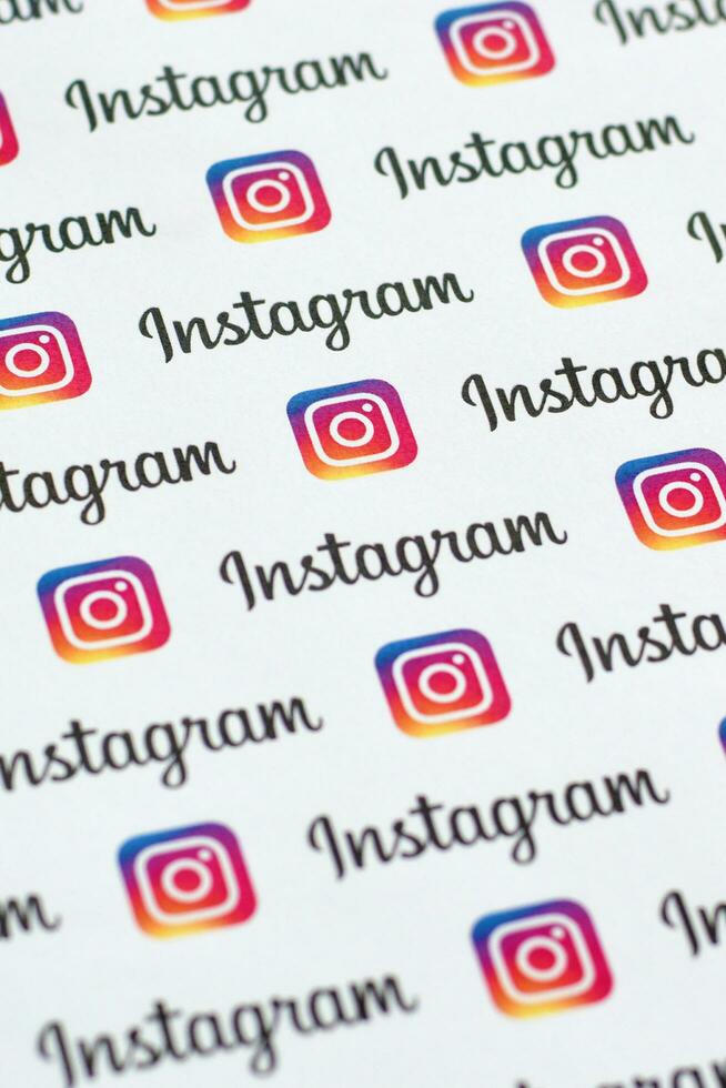 Instagram pattern printed on paper with small instagram logos and inscriptions. Instagram is American photo and video-sharing social networking service owned by Facebook