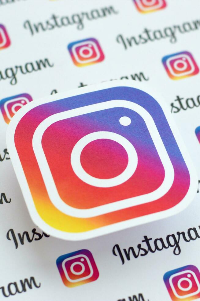 Instagram pattern printed on paper with small instagram logos and inscriptions. Instagram is American photo and video-sharing social networking service owned by Facebook