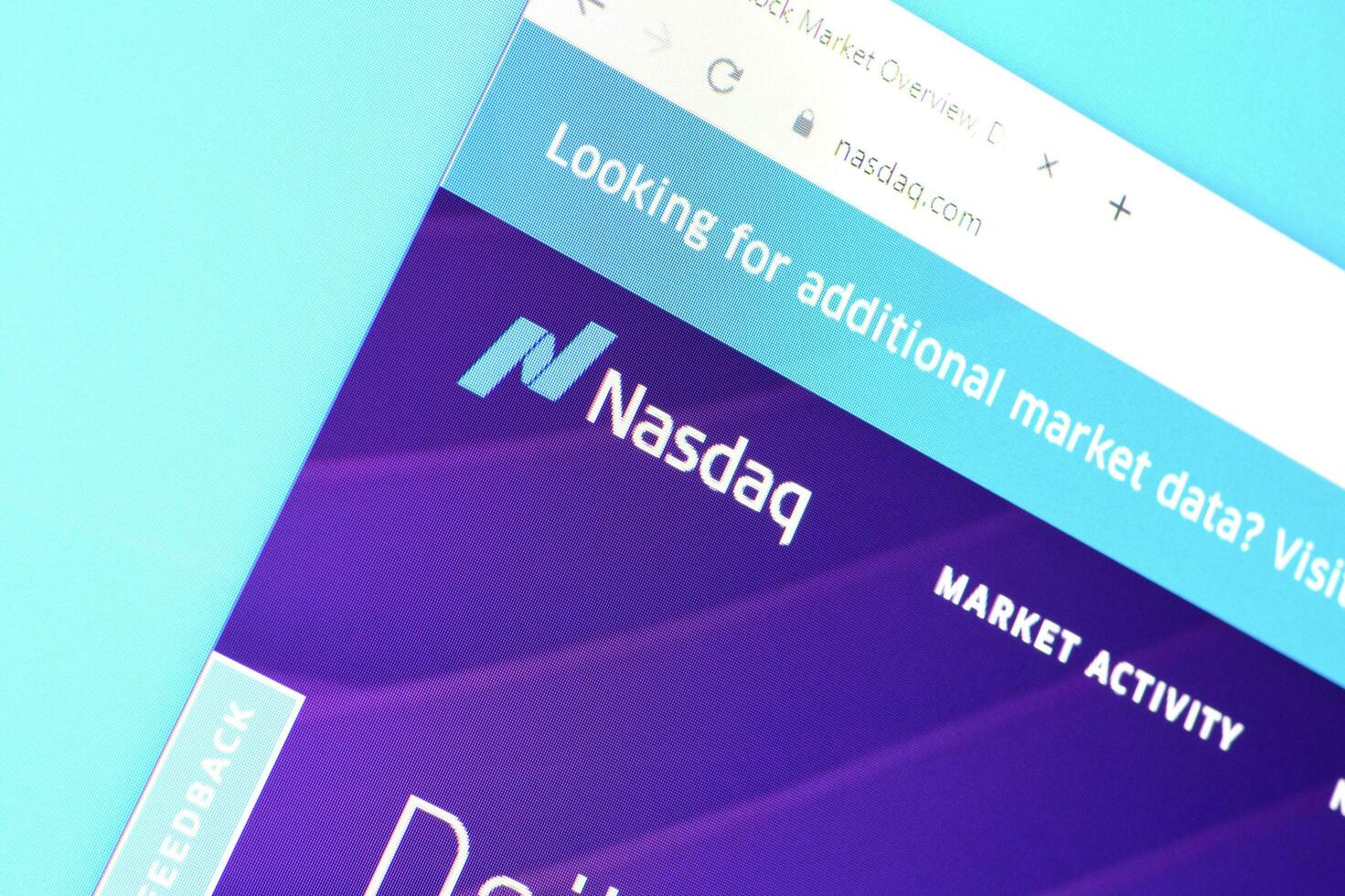 Homepage of nasdaq website on the display of PC, url - business.nasdaq.com. photo