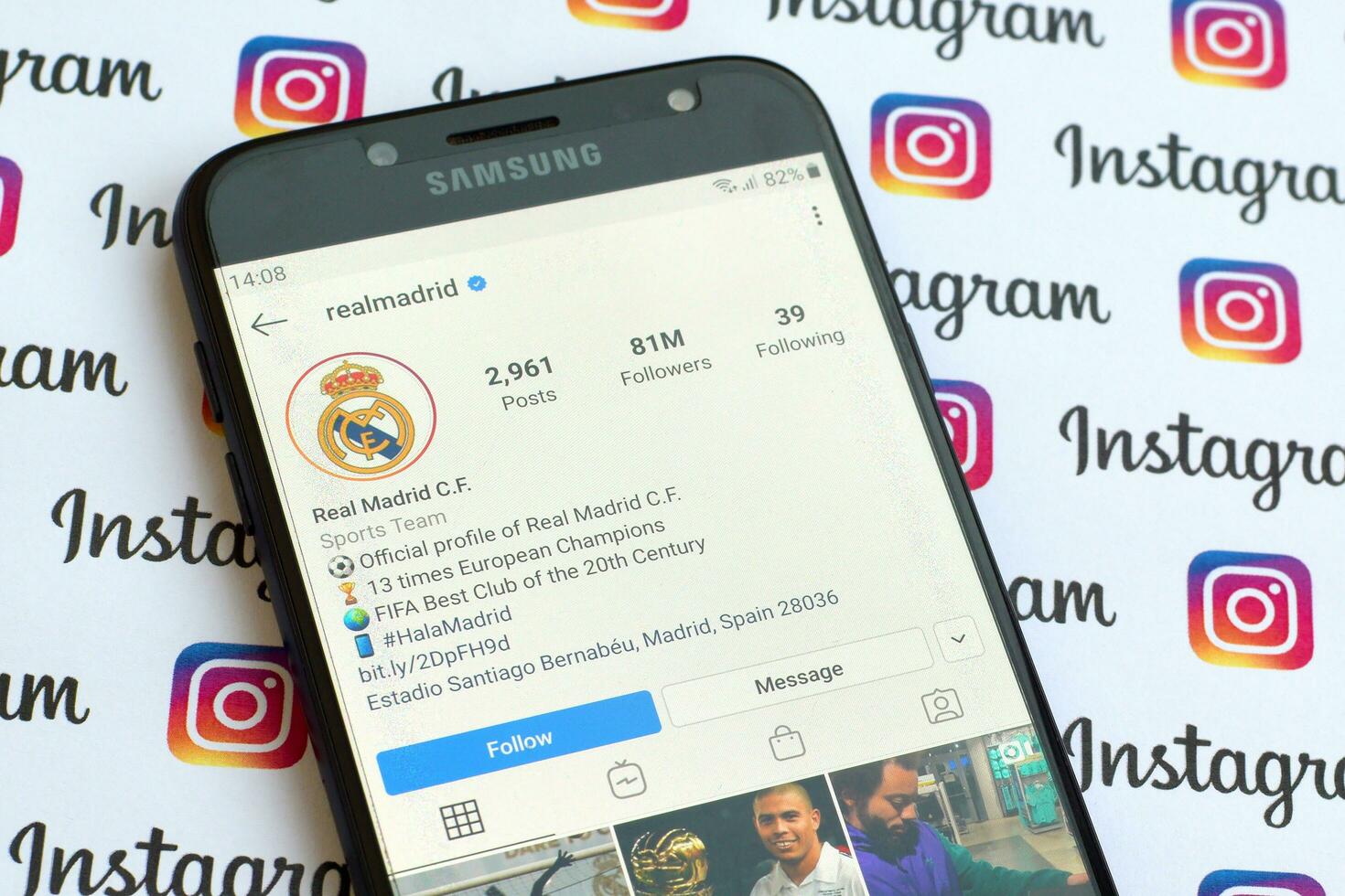 Real Madrid official instagram account on smartphone screen on paper instagram banner. photo