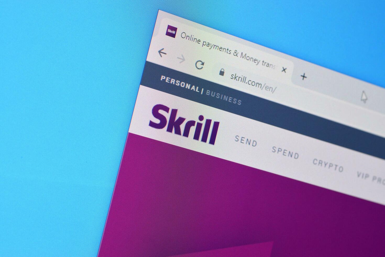Homepage of skrill website on the display of PC, url - skrill.com. photo