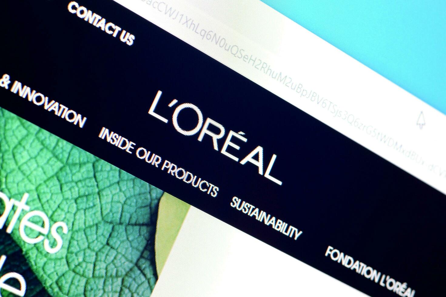 Homepage of loreal paris website on the display of PC, url - loreal.com. photo