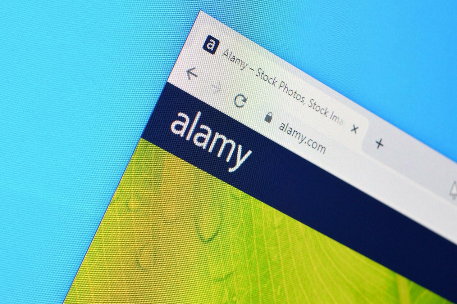 Homepage of alamy website on the display of PC, url - alamy.com. photo