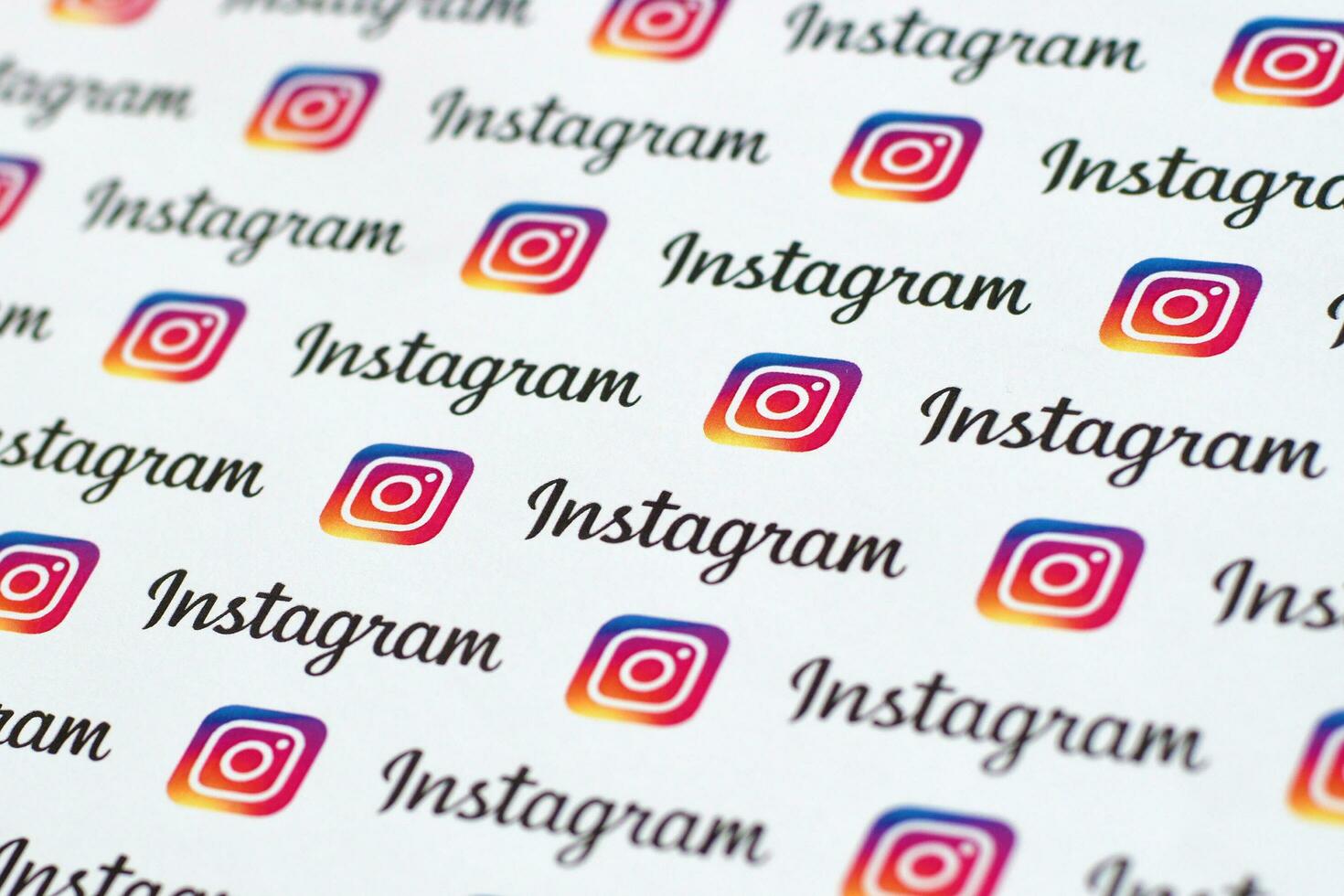 Instagram pattern printed on paper with small instagram logos and inscriptions. Instagram is American photo and video-sharing social networking service owned by Facebook