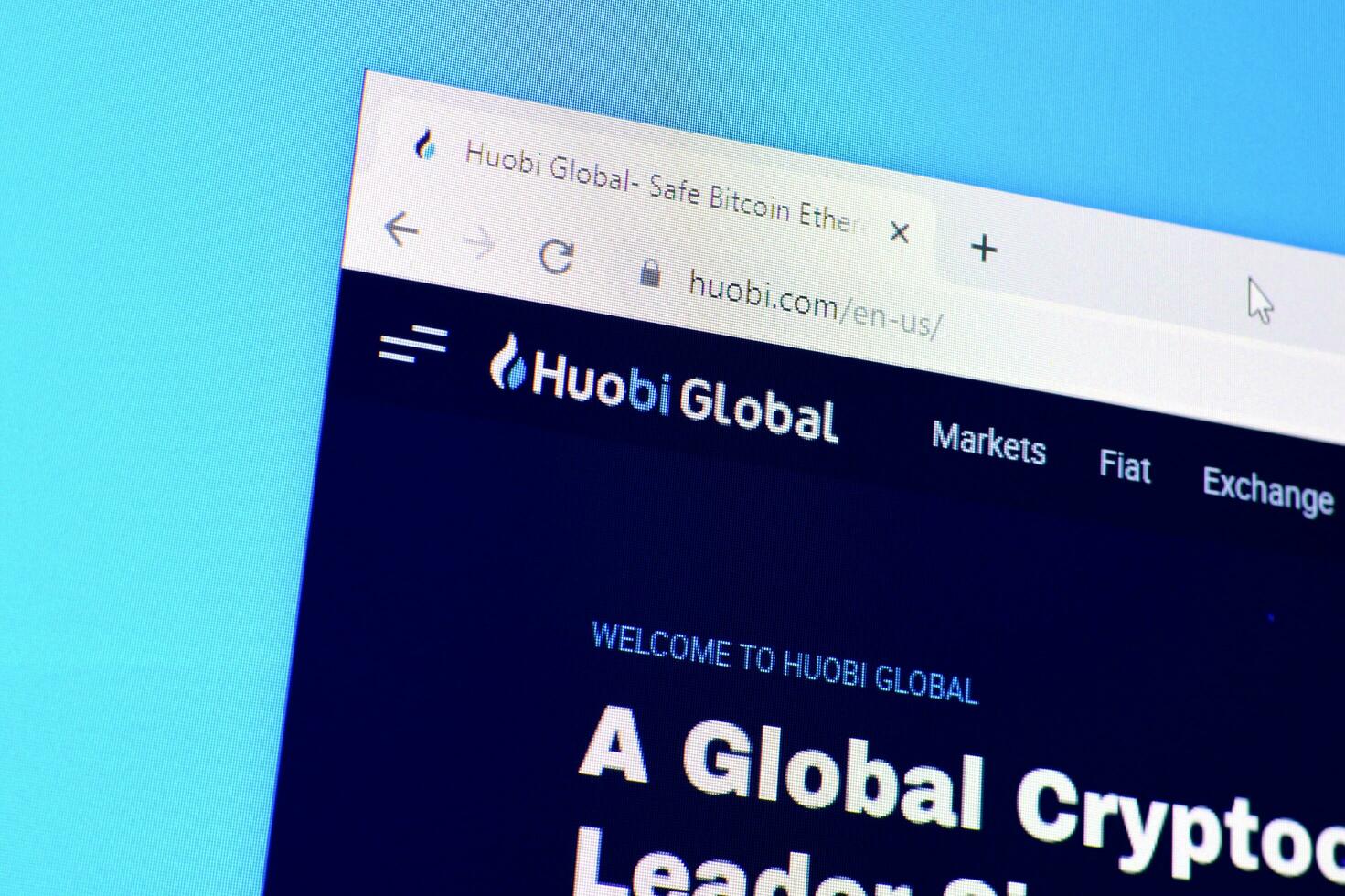 Homepage of huobi website on the display of PC, url - huobi.com. photo