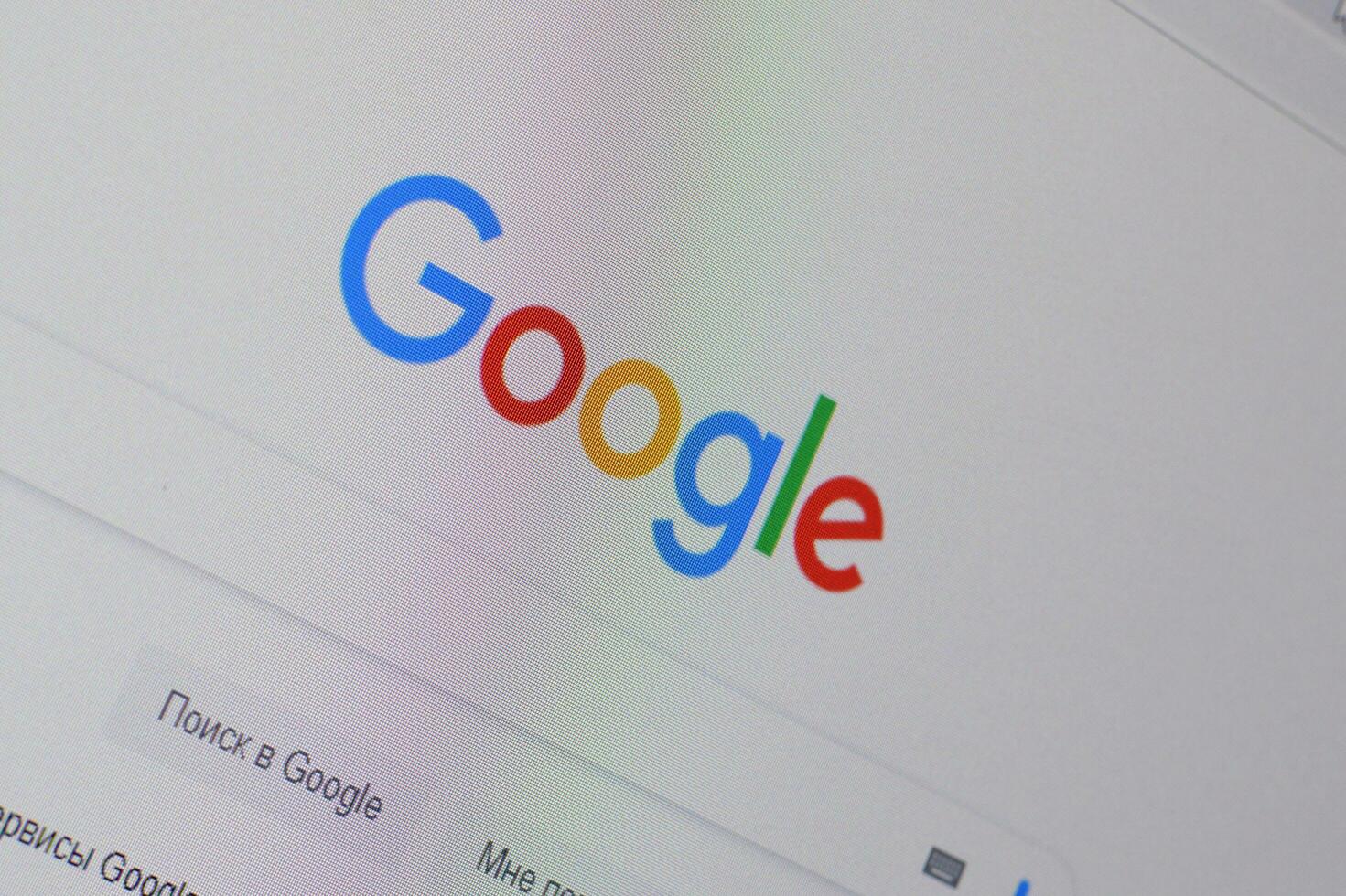 Homepage of google website on the display of PC, url - google.com. photo