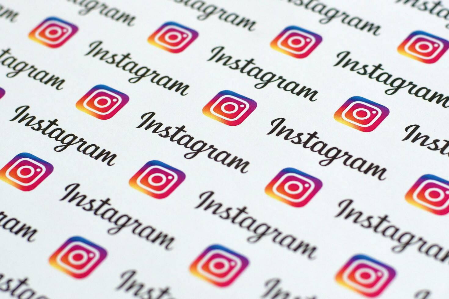 Instagram pattern printed on paper with small instagram logos and inscriptions. Instagram is American photo and video-sharing social networking service owned by Facebook