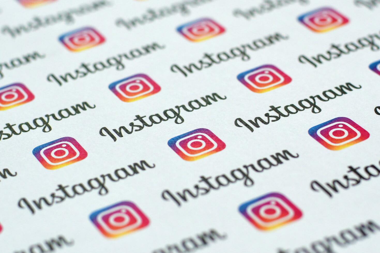 Instagram pattern printed on paper with small instagram logos and inscriptions. Instagram is American photo and video-sharing social networking service owned by Facebook