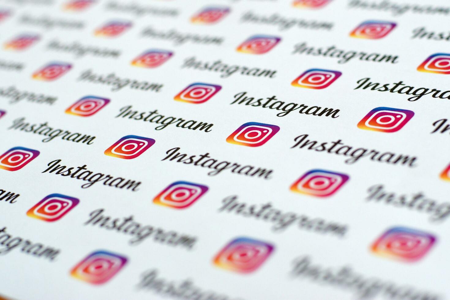 Instagram pattern printed on paper with small instagram logos and inscriptions. Instagram is American photo and video-sharing social networking service owned by Facebook