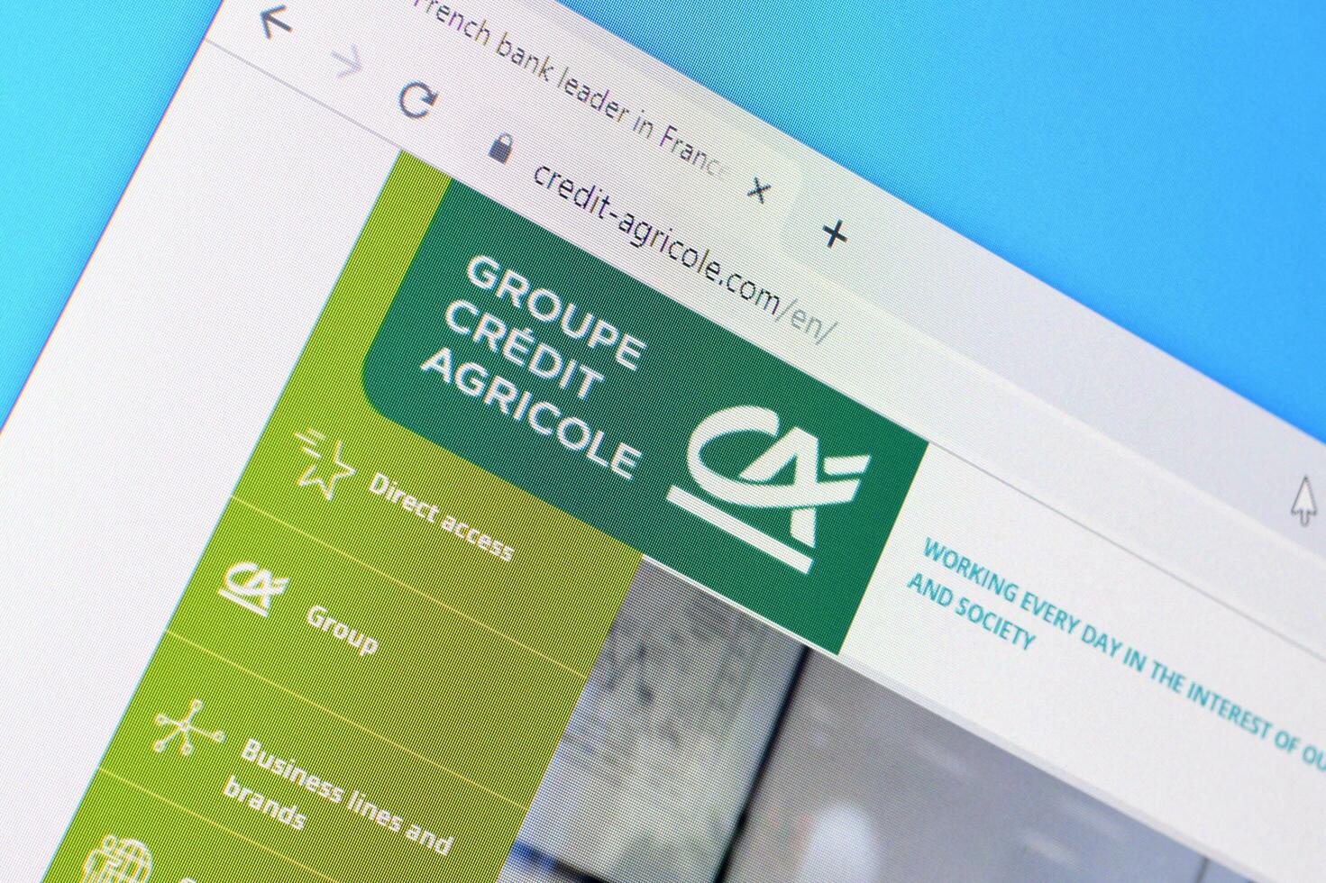 Homepage of credit-agricole website on the display of PC, url - credit-agricole.com. photo