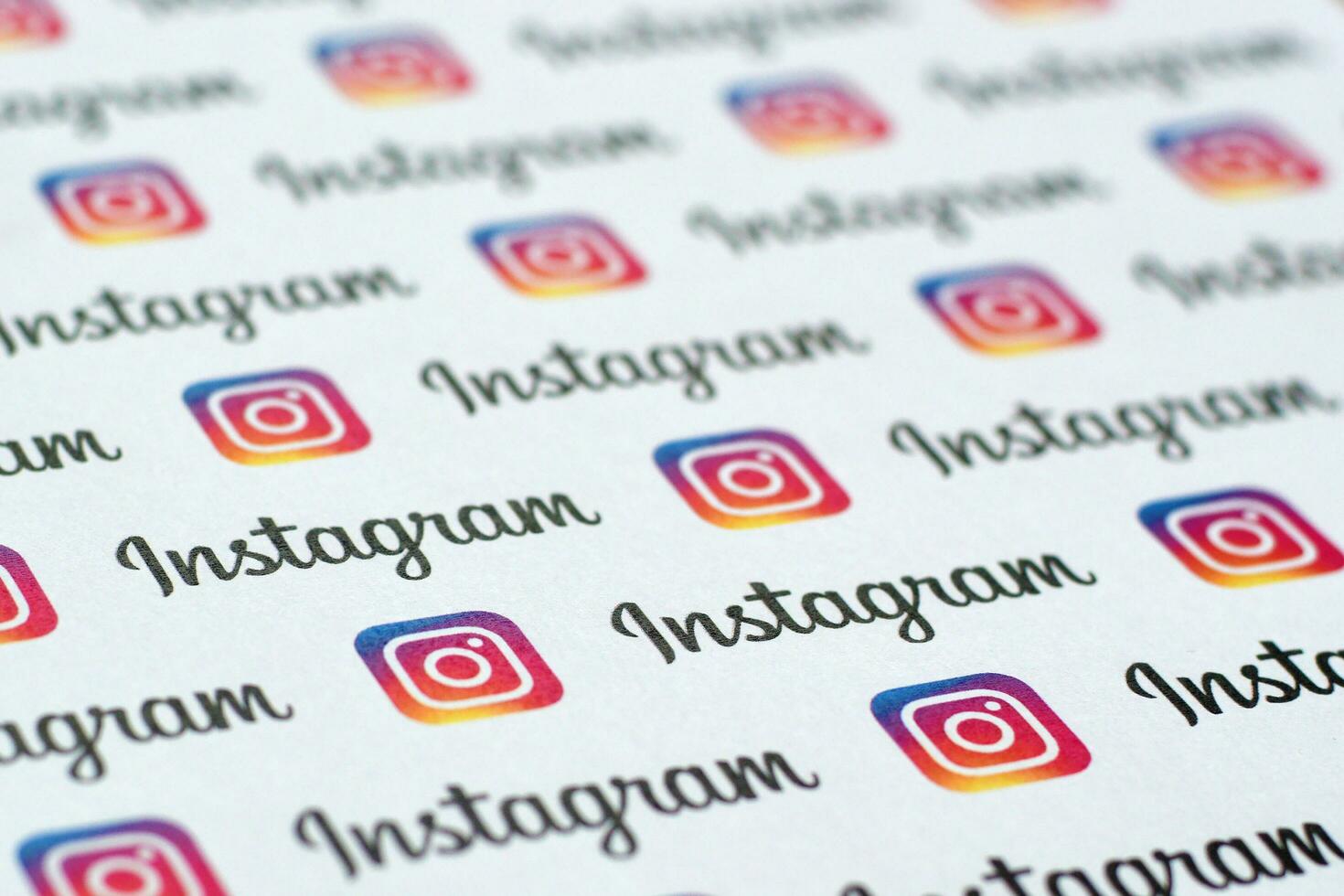 Instagram pattern printed on paper with small instagram logos and inscriptions. Instagram is American photo and video-sharing social networking service owned by Facebook