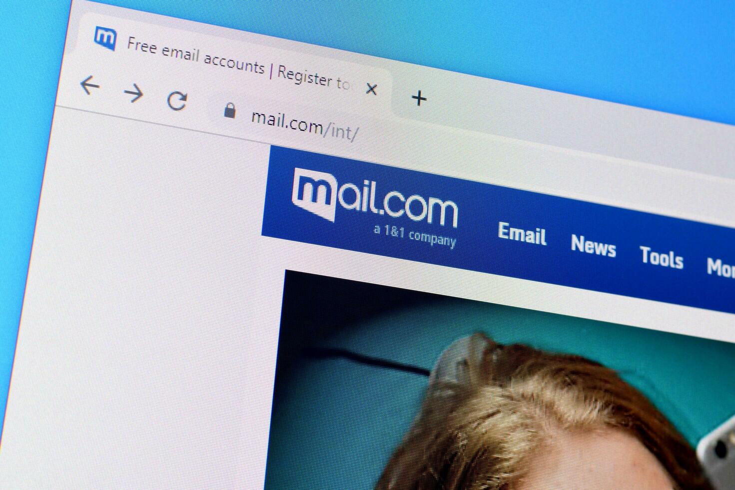 Homepage of mail com website on the display of PC, url - mail.com. photo