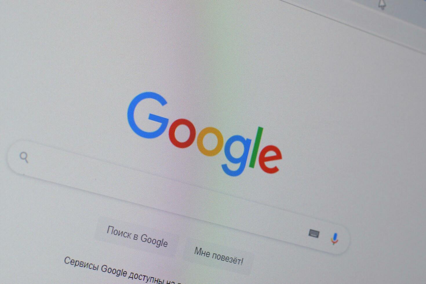 Homepage of google website on the display of PC, url - google.com. photo