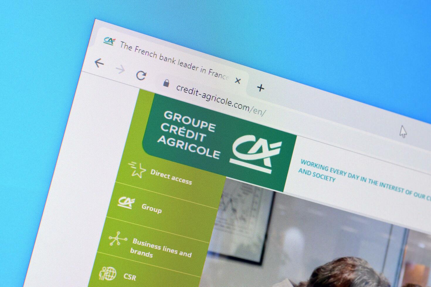 Homepage of credit-agricole website on the display of PC, url - credit-agricole.com. photo