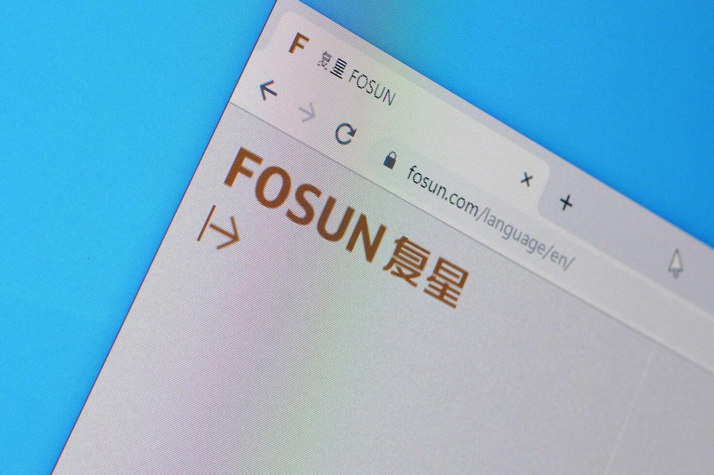 Homepage of fosun website on the display of PC, url - fosun.com. photo