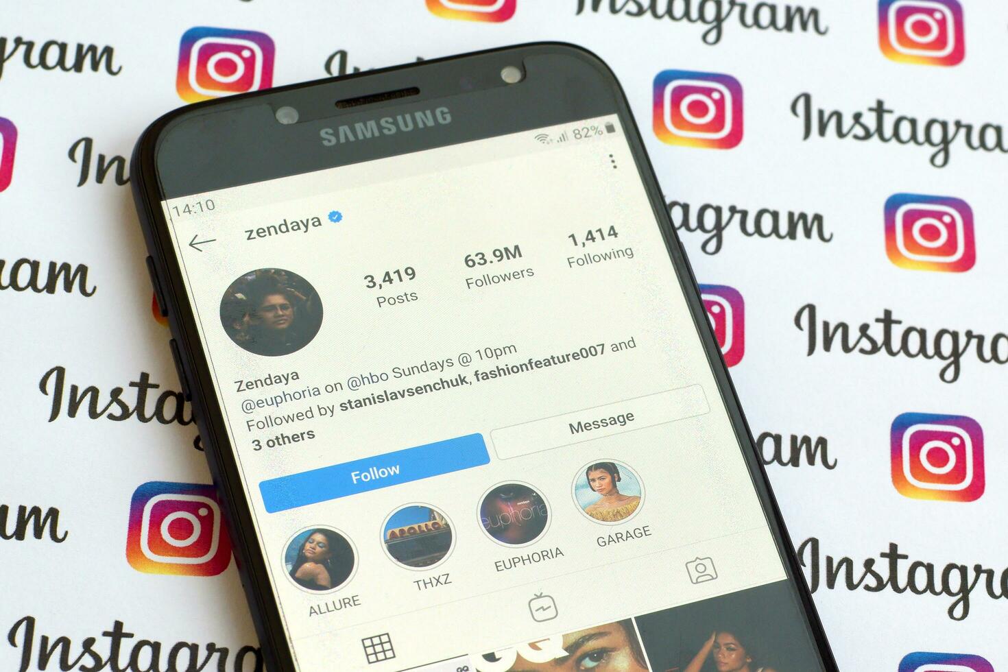 Zendaya official instagram account on smartphone screen on paper instagram banner. photo