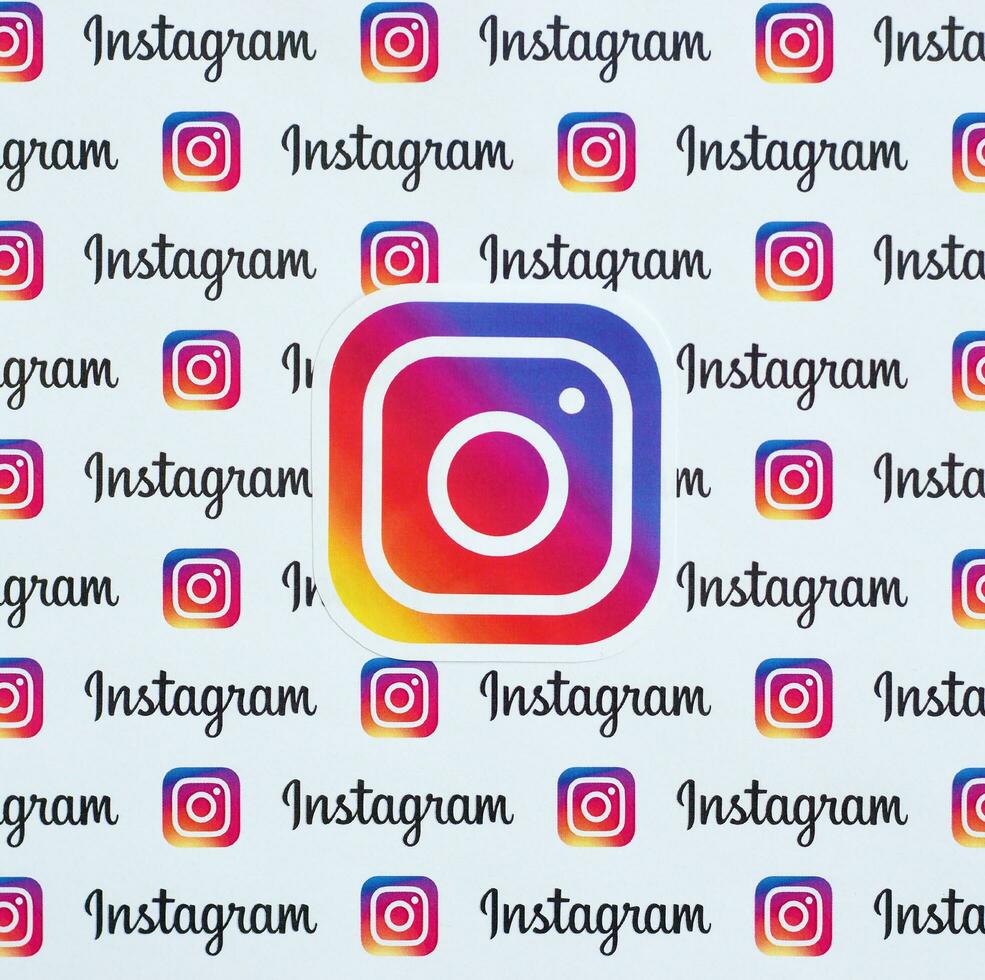 Instagram pattern printed on paper with small instagram logos and inscriptions. Instagram is American photo and video-sharing social networking service owned by Facebook