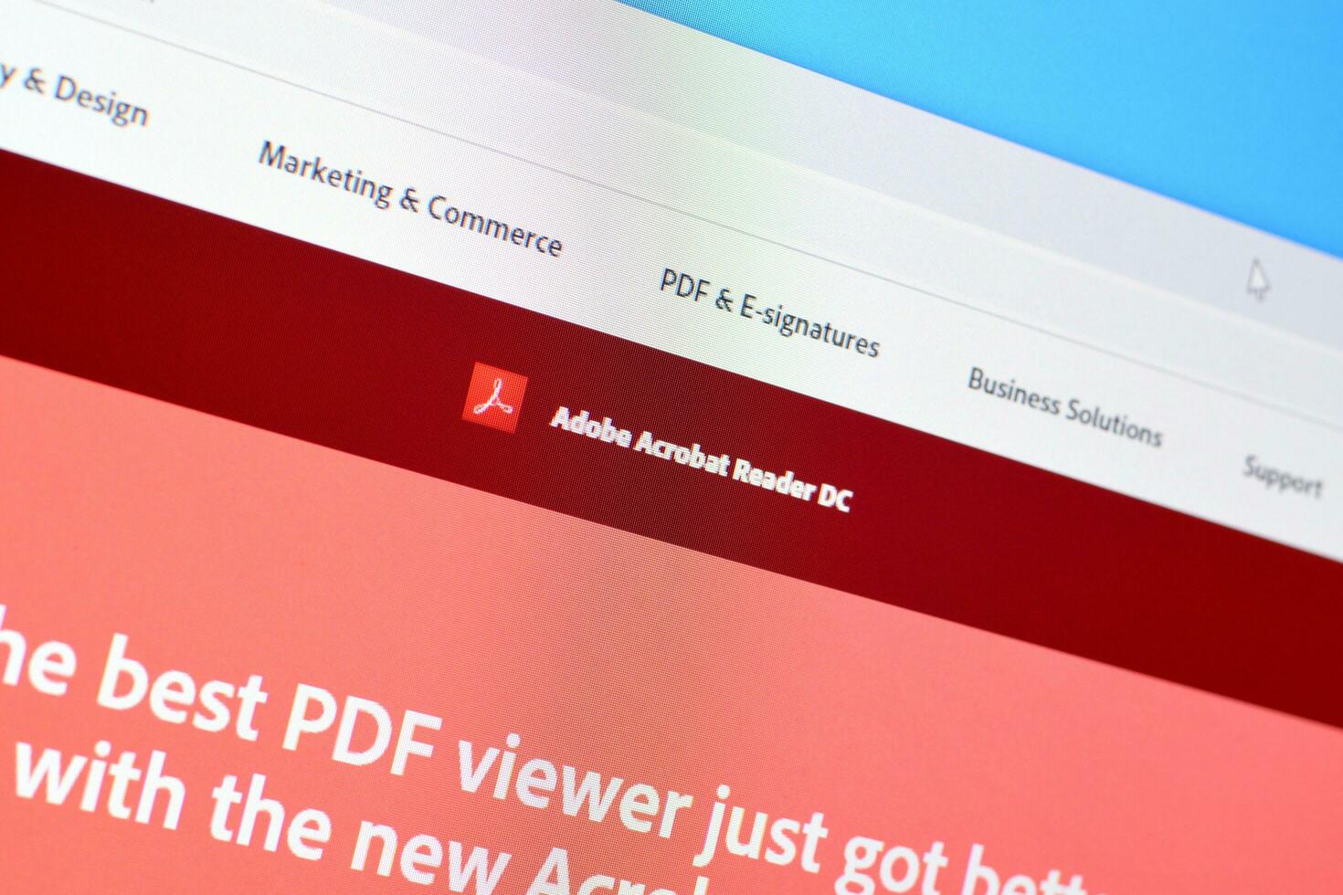 Web page of adobe acrobat reader product on official website on the display of PC photo