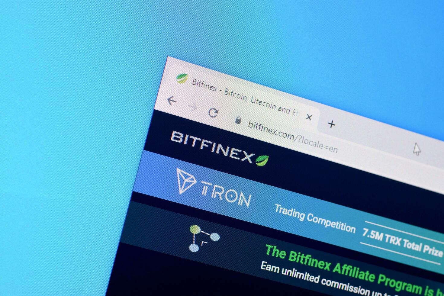 Homepage of bitfinex website on the display of PC, url - bitfinex.com. photo