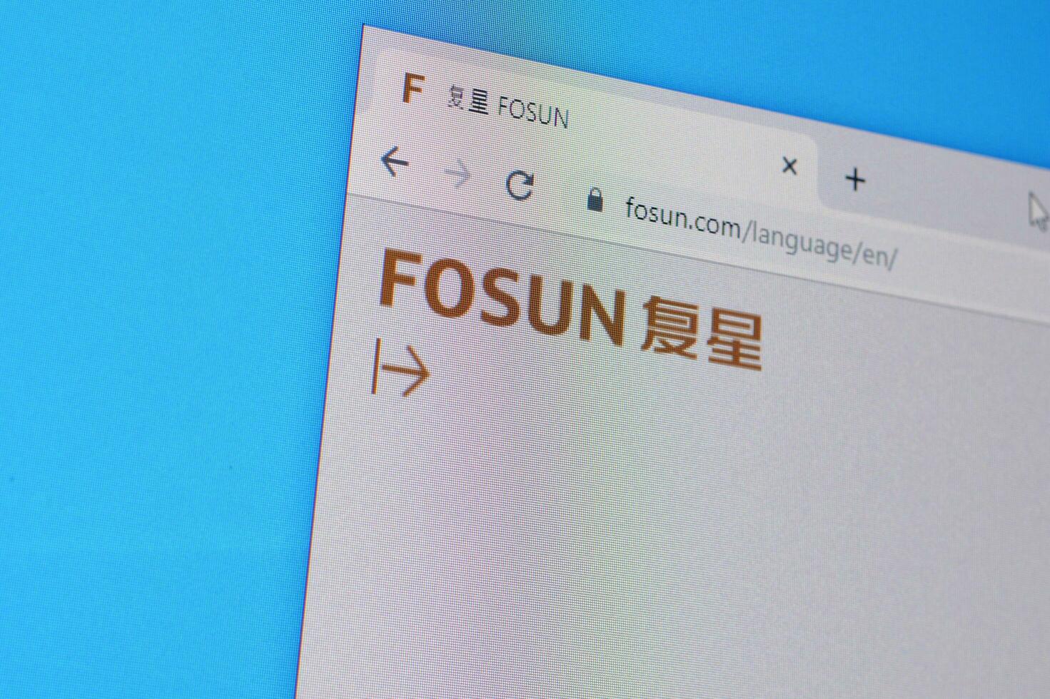 Homepage of fosun website on the display of PC, url - fosun.com. photo