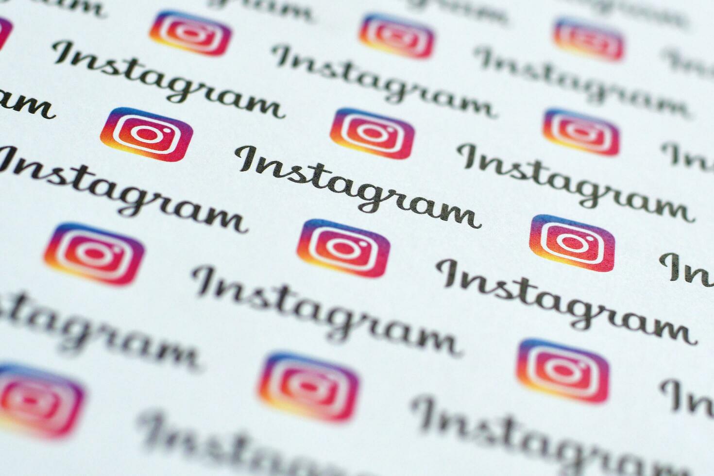 Instagram pattern printed on paper with small instagram logos and inscriptions. Instagram is American photo and video-sharing social networking service owned by Facebook