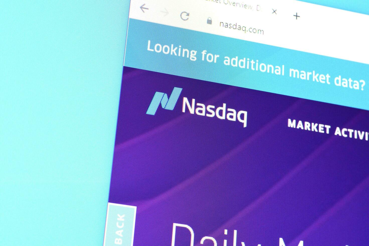 Homepage of nasdaq website on the display of PC, url - business.nasdaq.com. photo