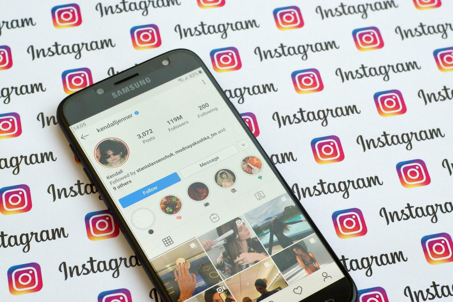 Kendall Jenner official instagram account on smartphone screen on paper instagram banner. photo